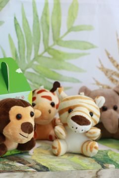 Safari-themed party favors with plush jungle animal toys